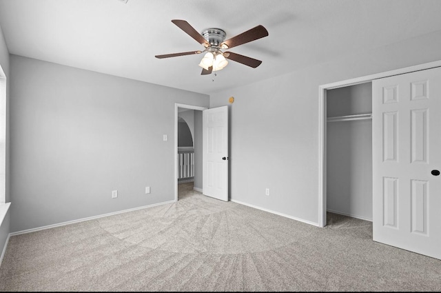 18222 Winding Timbers Ln, Humble, TX 77346 - unfurnished bedroom with carpet floors, a closet, baseboards, and ceiling fan