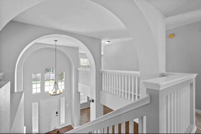 18222 Winding Timbers Ln, Humble, TX 77346 - hall featuring a chandelier, baseboards, and an upstairs landing