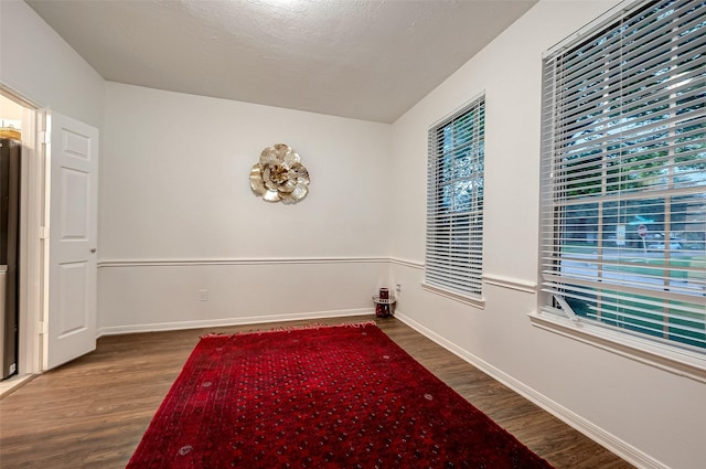 8719 Rose Garden Dr, Houston, TX 77083 - spare room with plenty of natural light, wood finished floors, and baseboards