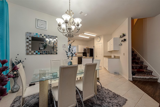 8719 Rose Garden Dr, Houston, TX 77083 - dining area with light tile patterned floors, a chandelier, stairs, and baseboards