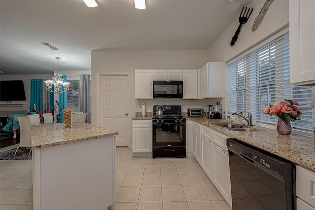 8719 Rose Garden Dr, Houston, TX 77083 - kitchen featuring black appliances, a sink, light tile patterned floors, a chandelier, and white cabinetry