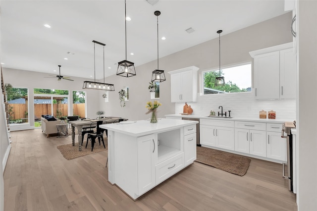 407 Sikes St, Houston, TX 77018 - kitchen with light wood-style flooring, light countertops, stainless steel range oven, and recessed lighting