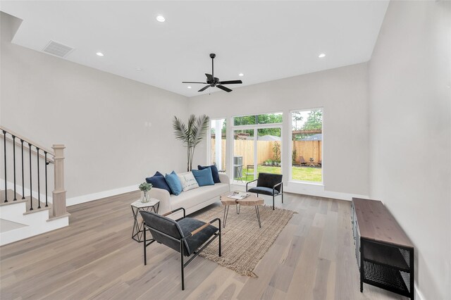 407 Sikes St, Houston, TX 77018 - living area with light wood finished floors, a ceiling fan, stairway, baseboards, and recessed lighting