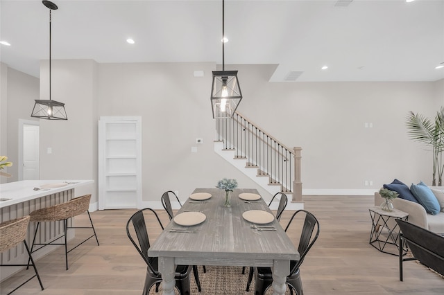 407 Sikes St, Houston, TX 77018 - dining space featuring stairs, light wood-style floors, and recessed lighting
