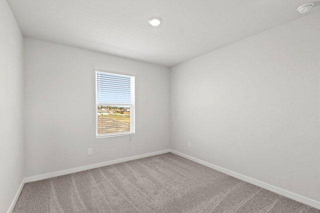 32923 Turning Springs Dr, Fulshear, TX 77423 - spare room featuring carpet floors, baseboards, and a smoke detector