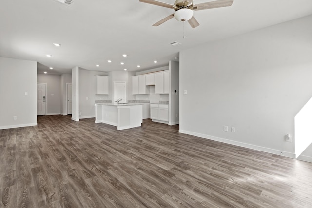32923 Turning Springs Dr, Fulshear, TX 77423 - unfurnished living room with recessed lighting, a ceiling fan, baseboards, and wood finished floors