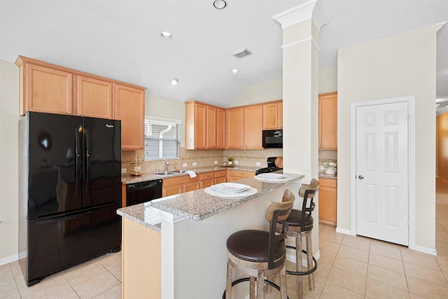 2918 Bright Sky Ct, Spring, TX 77386 - kitchen featuring black appliances, a sink, light brown cabinetry, light tile patterned flooring, and tasteful backsplash