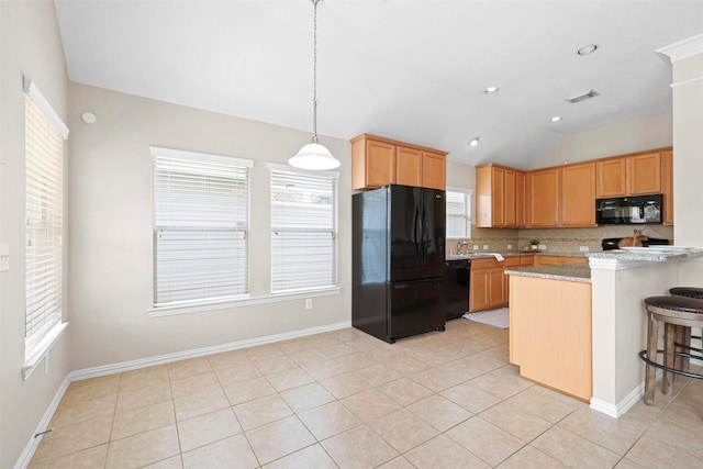 2918 Bright Sky Ct, Spring, TX 77386 - kitchen with black appliances, lofted ceiling, plenty of natural light, tasteful backsplash, and baseboards