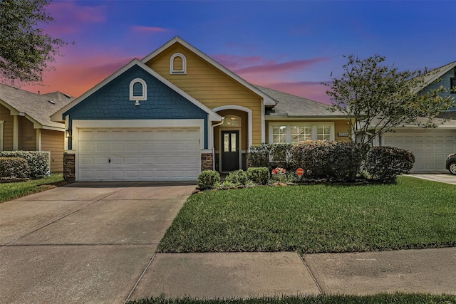 2918 Bright Sky Ct, Spring, TX 77386 - view of front facade with an attached garage, a yard, stone siding, and driveway