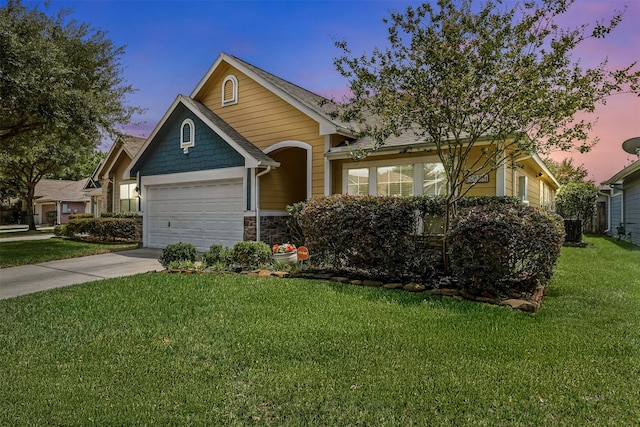 2918 Bright Sky Ct, Spring, TX 77386 - view of front of property featuring a garage, a front lawn, driveway, and stone siding