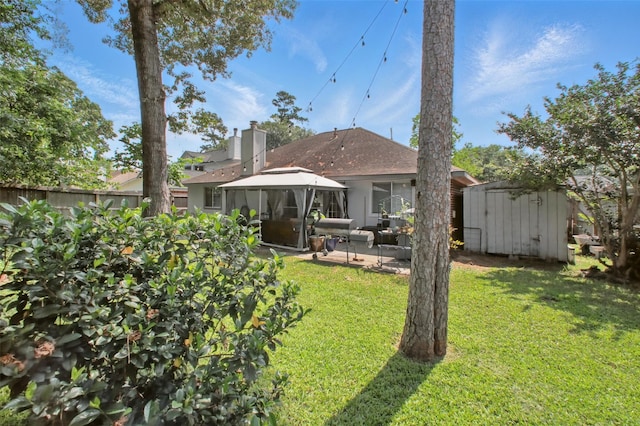 30915 Caraquet Ct, Spring, TX 77386 - rear view of property with a gazebo, a patio area, and a shingled roof
