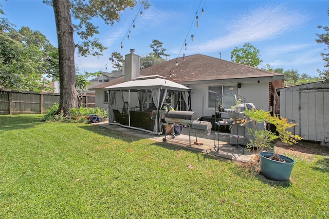 30915 Caraquet Ct, Spring, TX 77386 - back of property featuring a gazebo, a patio, a shingled roof, stucco siding, and an outdoor living space