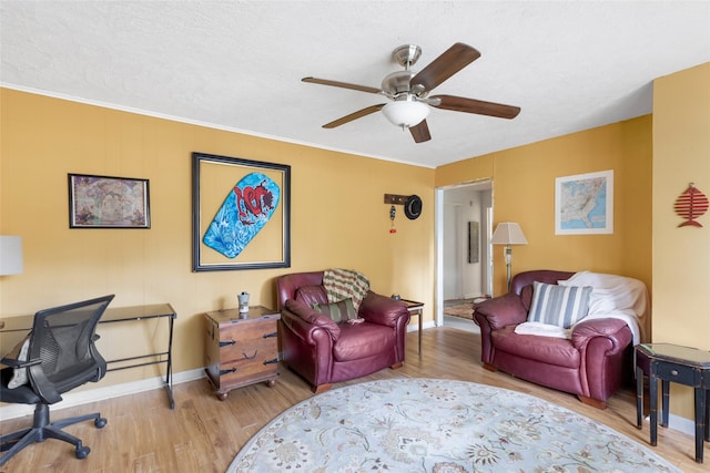 23718 E Webb Rd, Porter, TX 77365 - living area featuring wood finished floors, a ceiling fan, baseboards, and a textured ceiling