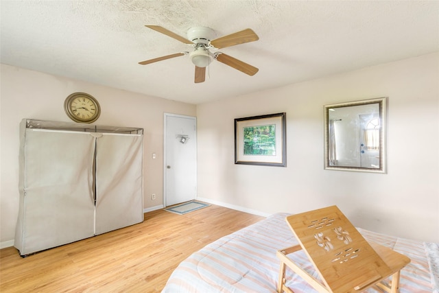 23718 E Webb Rd, Porter, TX 77365 - sitting room featuring light wood-type flooring, ceiling fan, and baseboards