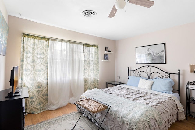 23718 E Webb Rd, Porter, TX 77365 - bedroom featuring wood finished floors and a ceiling fan