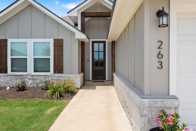 263 Brazos Bnd, Snook, TX 77879 - view of exterior entry featuring board and batten siding