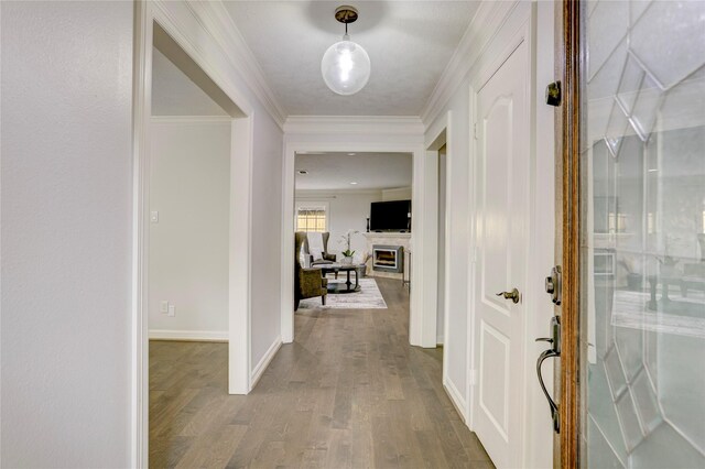 4414 Arnell Dr, Houston, TX 77018 - entryway with wood finished floors, a fireplace, crown molding, and baseboards