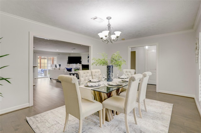 4414 Arnell Dr, Houston, TX 77018 - dining room with a chandelier, crown molding, wood finished floors, and baseboards