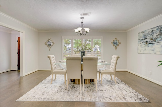 4414 Arnell Dr, Houston, TX 77018 - dining space featuring a chandelier, ornamental molding, wood finished floors, and baseboards