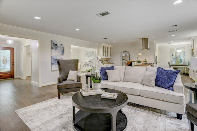 4414 Arnell Dr, Houston, TX 77018 - living area featuring crown molding, recessed lighting, wood finished floors, and baseboards