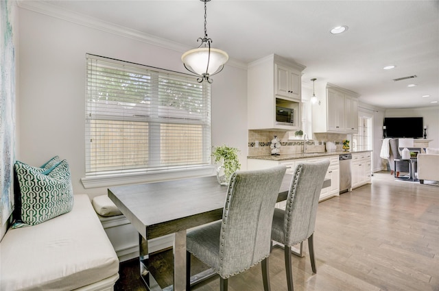 4414 Arnell Dr, Houston, TX 77018 - dining room featuring crown molding, light wood-style floors, and recessed lighting
