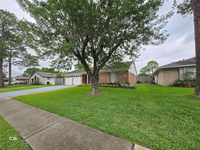 11834 Mulholland Dr, Meadows Place, TX 77477 - view of front of property featuring concrete driveway, brick siding, an attached garage, and central AC