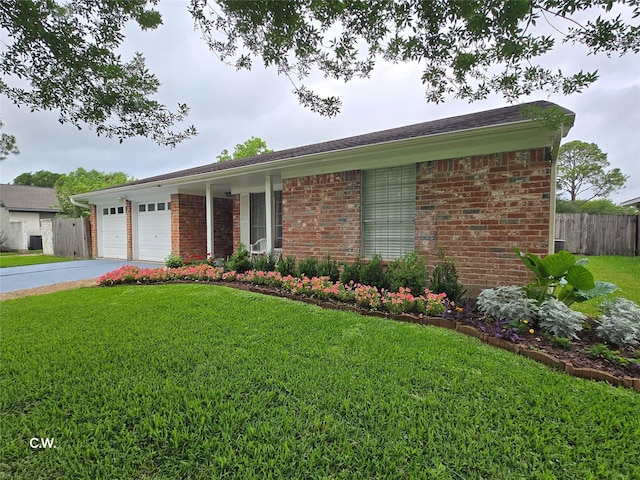 11834 Mulholland Dr, Meadows Place, TX 77477 - ranch-style home with brick siding, a garage, and driveway