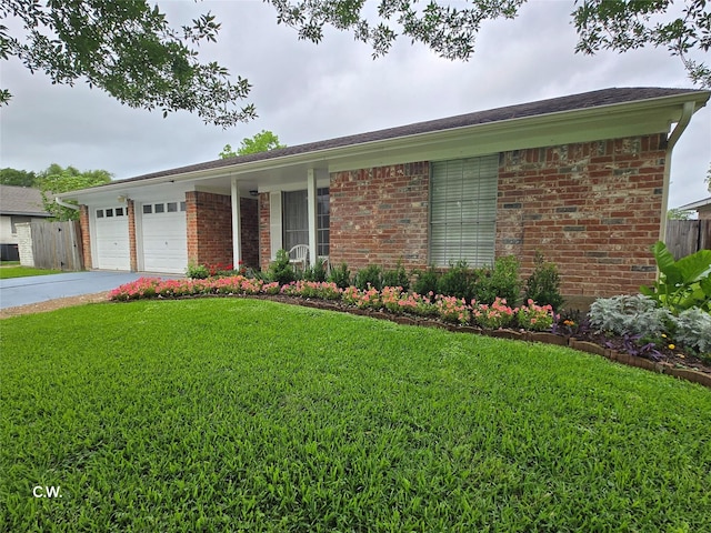11834 Mulholland Dr, Meadows Place, TX 77477 - ranch-style home with brick siding, an attached garage, and concrete driveway