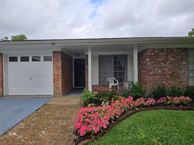 11834 Mulholland Dr, Meadows Place, TX 77477 - view of front of property featuring brick siding, a porch, a garage, and concrete driveway
