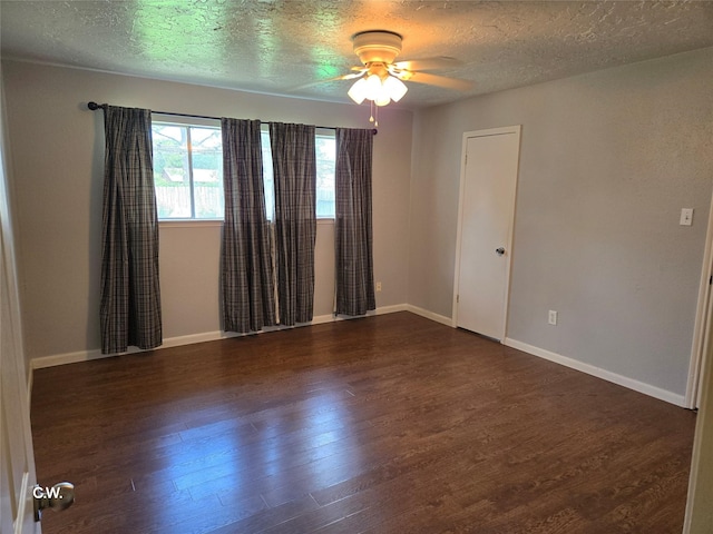 11834 Mulholland Dr, Meadows Place, TX 77477 - unfurnished room with wood finished floors, a textured ceiling, ceiling fan, and baseboards