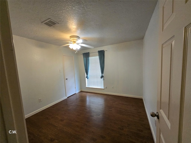 11834 Mulholland Dr, Meadows Place, TX 77477 - empty room featuring dark wood-style flooring, a textured ceiling, ceiling fan, and baseboards