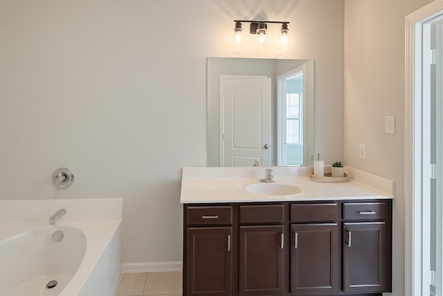 2507 Ocean Cove Cir, Rosenberg, TX 77469 - full bath with vanity, a bath, tile patterned flooring, and baseboards