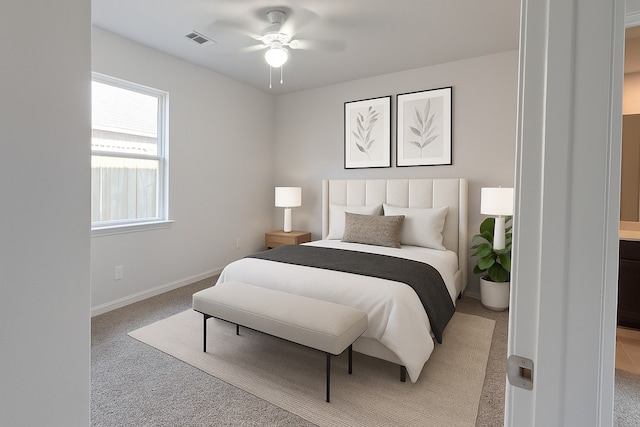 2507 Ocean Cove Cir, Rosenberg, TX 77469 - bedroom with light colored carpet, baseboards, and a ceiling fan