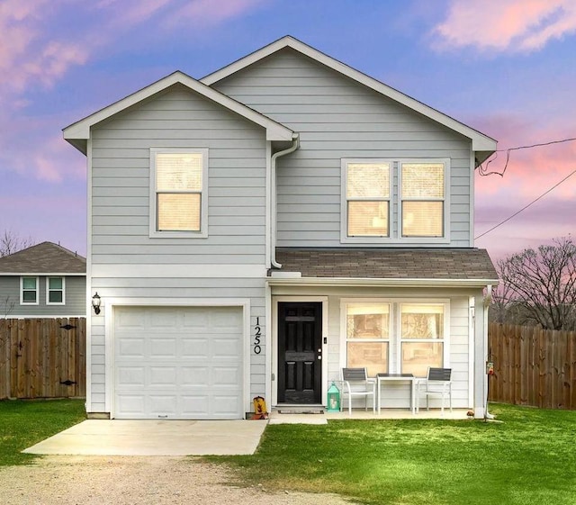 1250 22nd St, Hempstead, TX 77445 - traditional-style house with a garage, driveway, covered porch, and roof with shingles