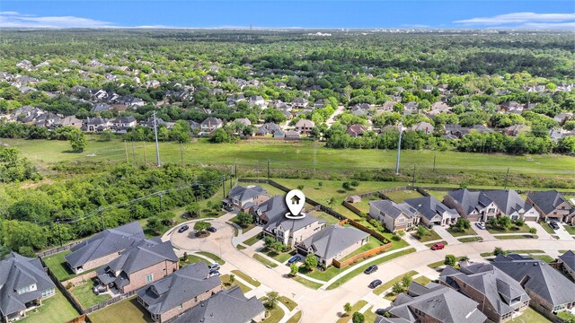 5711 Greenwood Colony Ct, Houston, TX 77059 - aerial perspective of suburban area featuring a heavily wooded area