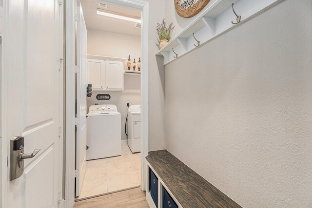 5711 Greenwood Colony Ct, Houston, TX 77059 - washroom featuring washing machine and clothes dryer and cabinet space