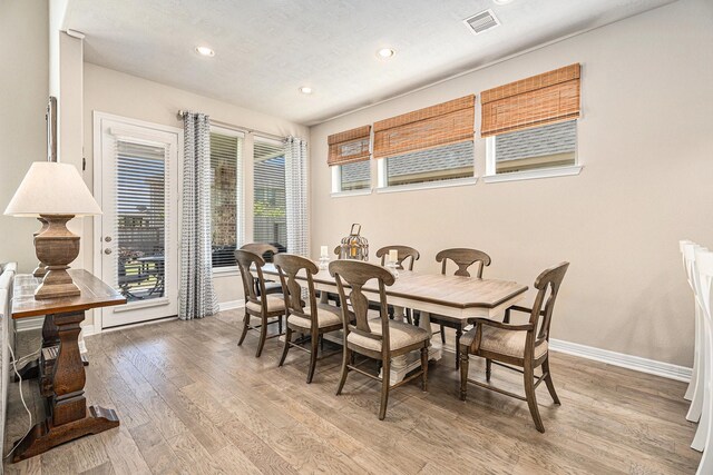 5711 Greenwood Colony Ct, Houston, TX 77059 - dining space featuring baseboards, light wood-type flooring, and recessed lighting