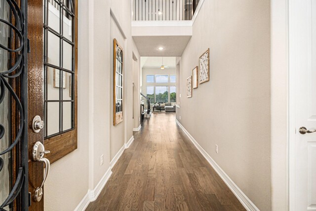 5711 Greenwood Colony Ct, Houston, TX 77059 - hall with dark wood-style flooring and baseboards