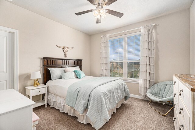5711 Greenwood Colony Ct, Houston, TX 77059 - bedroom with carpet flooring, a ceiling fan, and baseboards