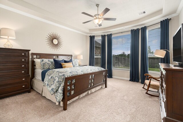 5711 Greenwood Colony Ct, Houston, TX 77059 - bedroom with a tray ceiling, light colored carpet, baseboards, ceiling fan, and crown molding