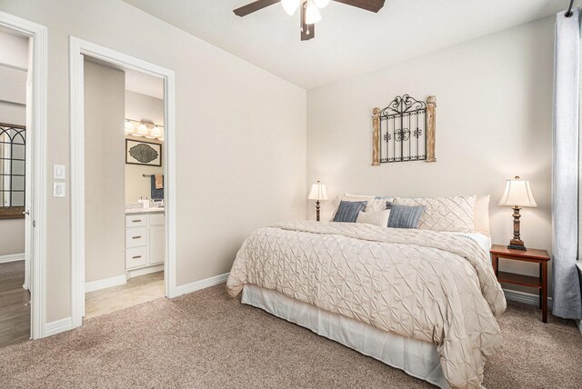 5711 Greenwood Colony Ct, Houston, TX 77059 - bedroom featuring light carpet, connected bathroom, baseboards, and a ceiling fan