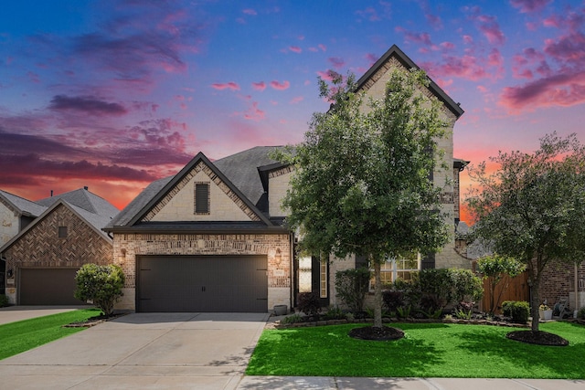 5711 Greenwood Colony Ct, Houston, TX 77059 - french provincial home featuring concrete driveway, an attached garage, a front yard, brick siding, and stone siding