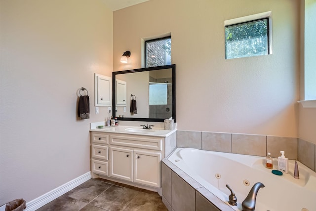 1102 Nautical Ln, Richmond, TX 77469 - bathroom featuring a jetted tub, vanity, baseboards, a tile shower, and tile patterned flooring