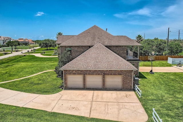 1102 Nautical Ln, Richmond, TX 77469 - view of property exterior featuring roof with shingles, driveway, and brick siding