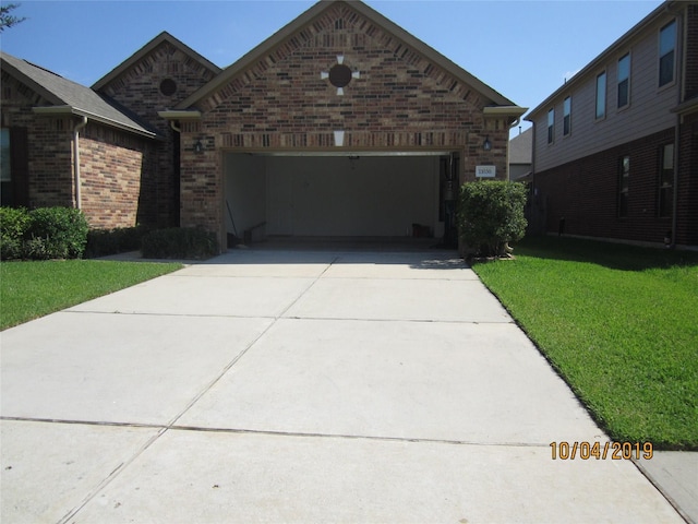 11030 Jacob Crossing Dr, Richmond, TX 77406 - view of front of home featuring brick siding, a front lawn, concrete driveway, and an attached garage