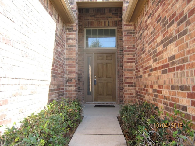 11030 Jacob Crossing Dr, Richmond, TX 77406 - doorway to property featuring brick siding