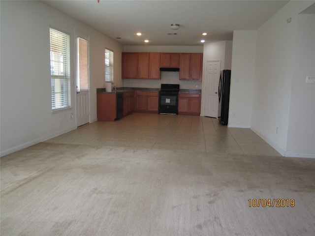 11030 Jacob Crossing Dr, Richmond, TX 77406 - kitchen featuring black appliances, light colored carpet, baseboards, and recessed lighting