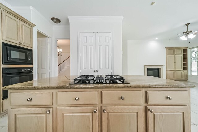 13331 Brentonwood Ln, Houston, TX 77077 - kitchen featuring black appliances, light brown cabinets, a ceiling fan, light stone countertops, and light tile patterned floors