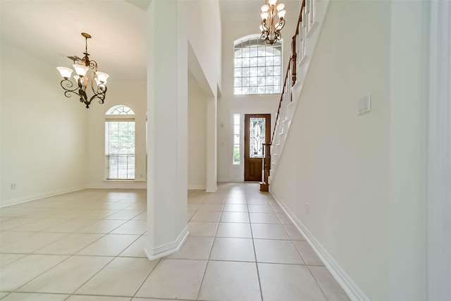 13331 Brentonwood Ln, Houston, TX 77077 - foyer entrance featuring a chandelier, plenty of natural light, and light tile patterned floors