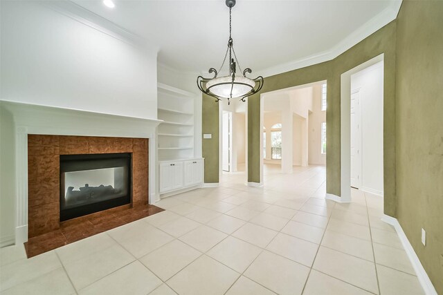 13331 Brentonwood Ln, Houston, TX 77077 - unfurnished living room featuring crown molding, baseboards, built in shelves, tile patterned floors, and a tiled fireplace